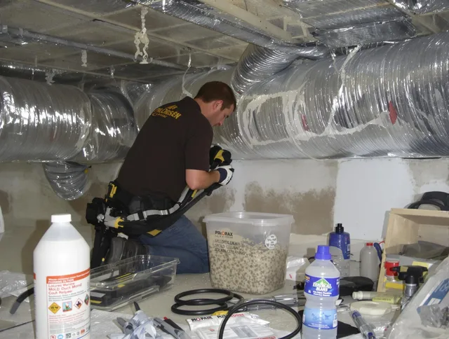 Northborough Air Duct Cleaning specialist performing professional mold removal from air ducts in Northborough