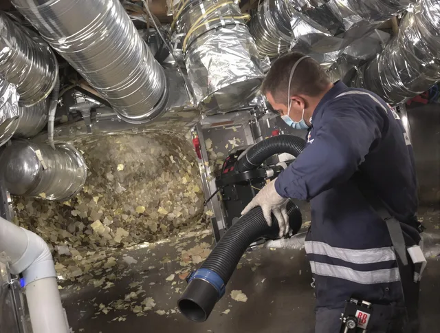 Northborough Air Duct Cleaning specialist operating negative pressure cleaning equipment for thorough duct maintenance in Northborough