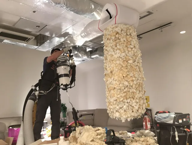 Northborough Air Duct Cleaning technician performing precision vacuum insulation removal in a residential property in Northborough