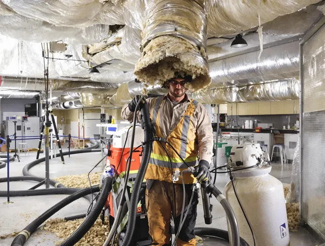 Professional vacuum insulation removal by Northborough Air Duct Cleaning expert in Northborough